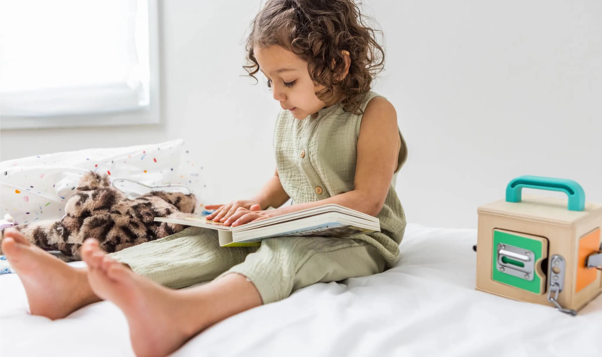 Child reading a Lovevery board book