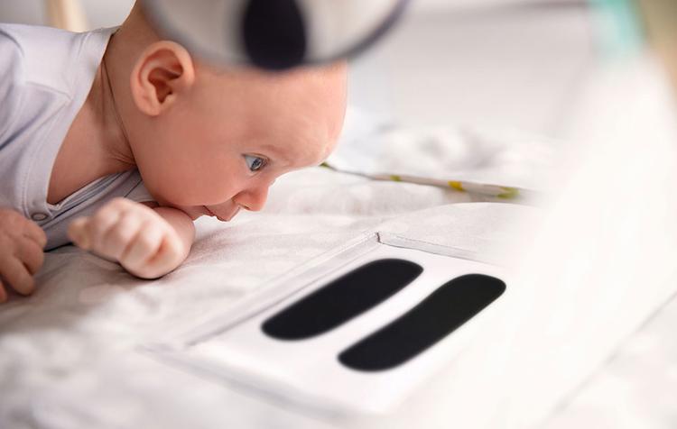 Baby doing tummy time on The Play Gym by Lovevery